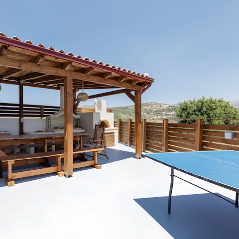 Play ping pong with a view ahead of a barbecue lunch under the pergola