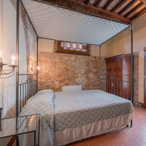 Sink into the four poster bed after a day hiking the Tuscan countryside