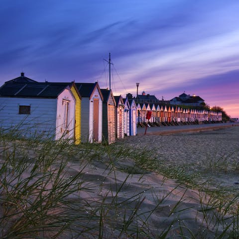 Take an evening stroll along Southwold's sandy beach, just a twelve-minute walk away 