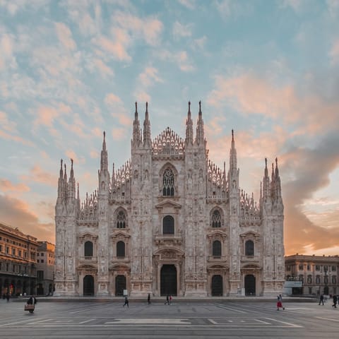 Visit the famous Duomo di Milano, a fourteen-minute walk away