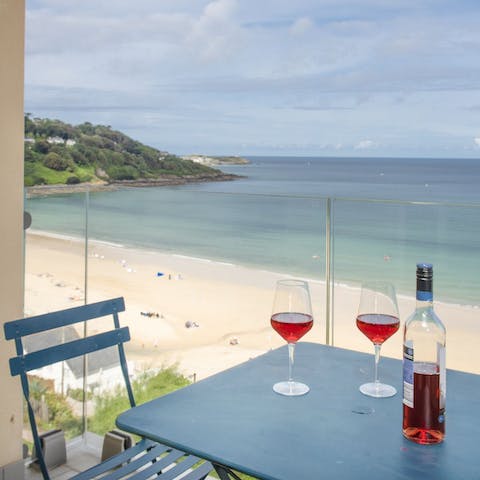 Gaze out over the award-winning Carbis Bay Beach from your private balcony