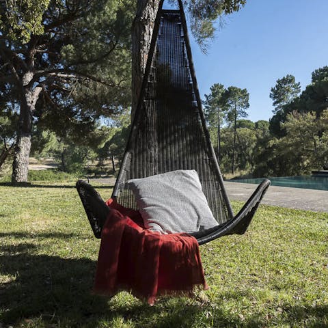 Lounge about in the sun with a good book in the hanging chair