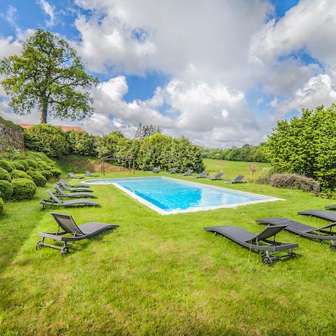 Slip away to the chateau's shared swimming pool for a cooling dip