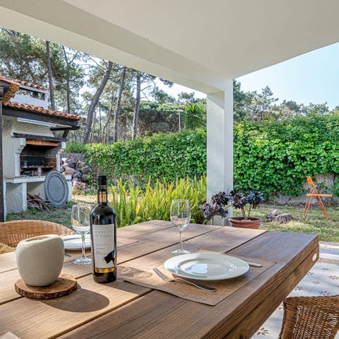 Gather round the alfresco dining table and dig into porco preto