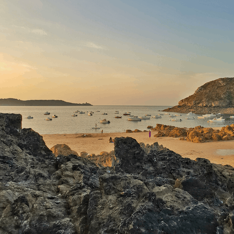 Explore Saint-Cast in France, and take a stroll along Pen Guen beach at golden hour