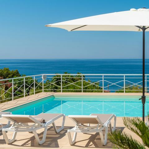 Take in the epic sea views from your pool lounger