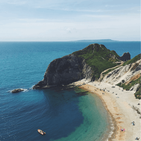 Pack up a beach bag for a day along the Jurassic Coast, just a short drive away