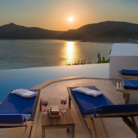 Watch the sun set behind the hills from the private terrace