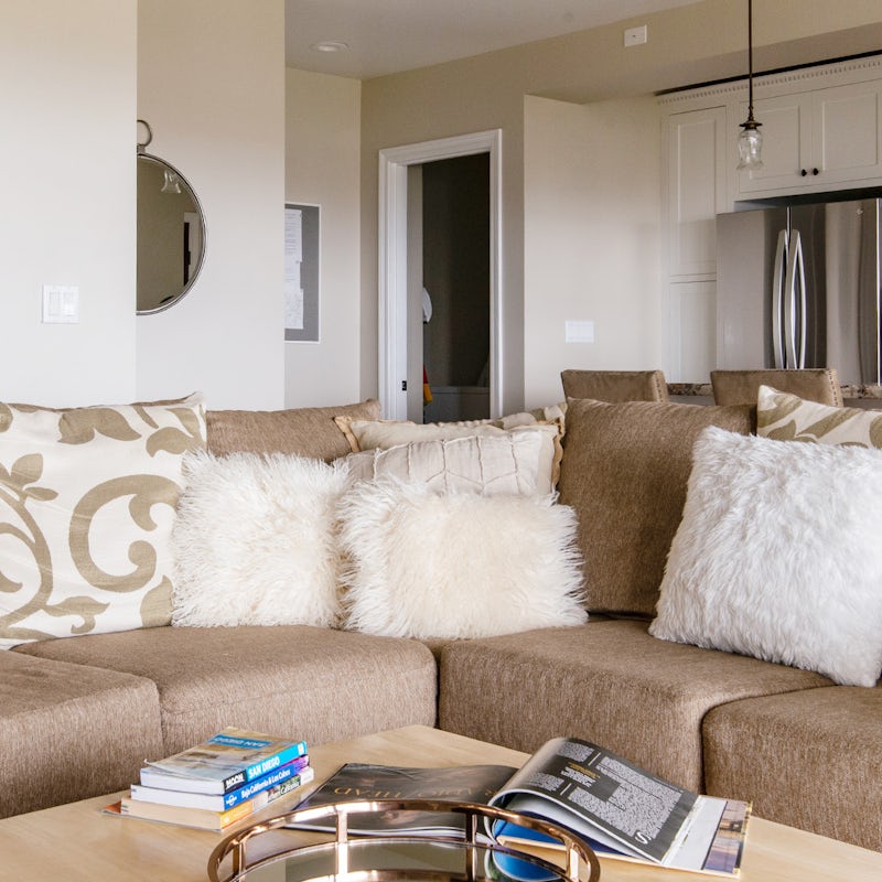 Nestle among the cushions on the comfy L-shaped sofa