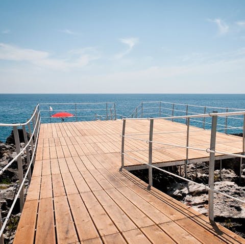 Make your way down the steps for direct access to the swim platform