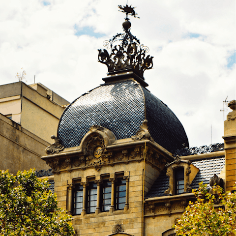 Stroll towards Passeig de Gràcia for sightseeing and shopping