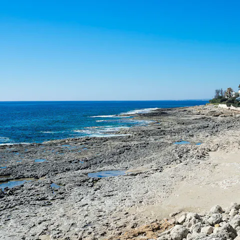 Stroll just a few steps to the rocky beach – you'll find soft white sand beaches 1km away