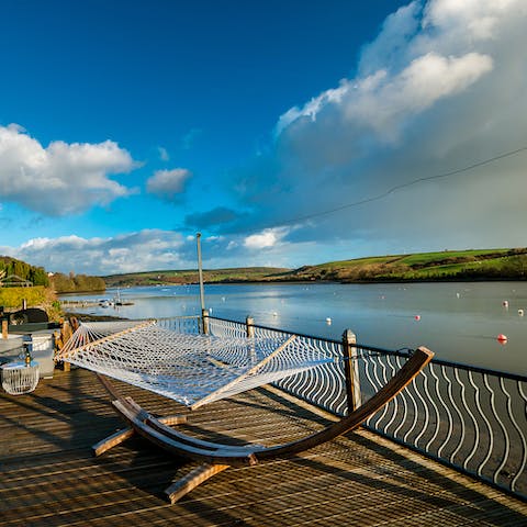 Lounge in the hammock beside the water and doze off to the sounds of the river