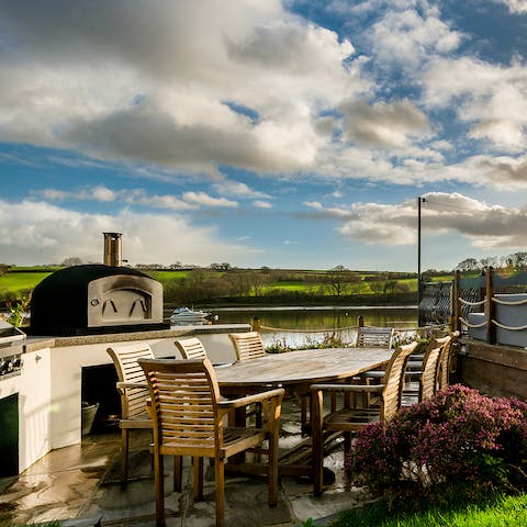 Serve up a waterside feast with the help of the barbecue and pizza oven