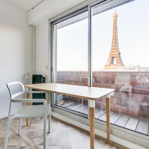 Get an eyeful of the Eiffel Tower as you catch up on work in the bedroom