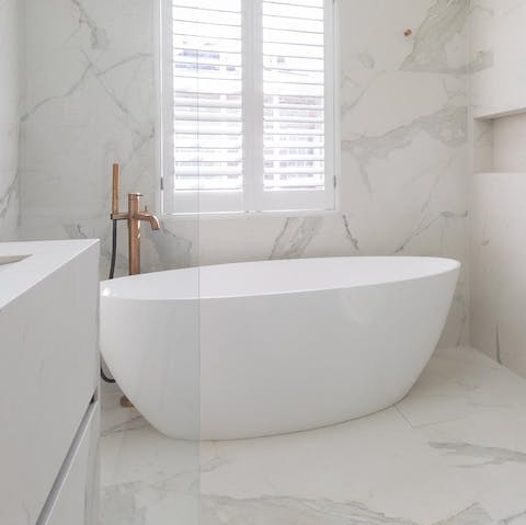 Treat yourself to a relaxing soak in the freestanding bath