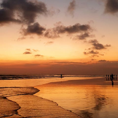 Take a stroll along the pristine sands of Seminyak Beach, it's steps away