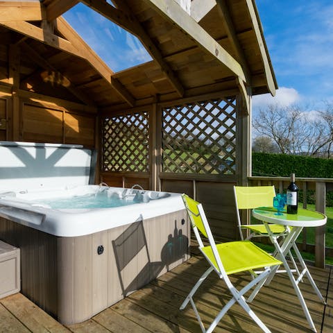 Relax in the hot tub after a full day exploring 