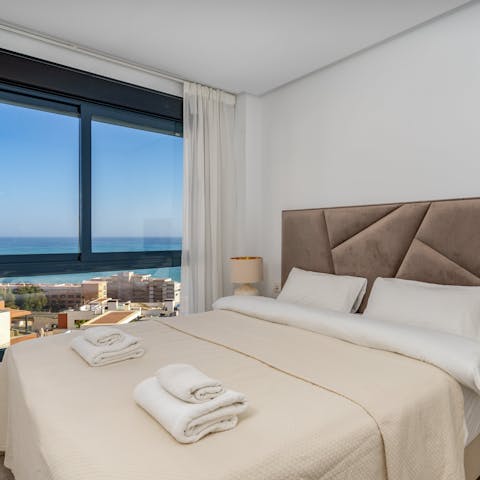 Wake up to sunshine and sea views in the comfy main bedroom