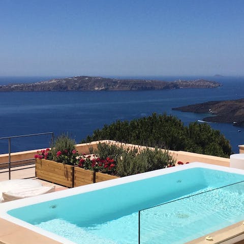 Admire the view of the Santorini caldera from the comfort of the hot tub