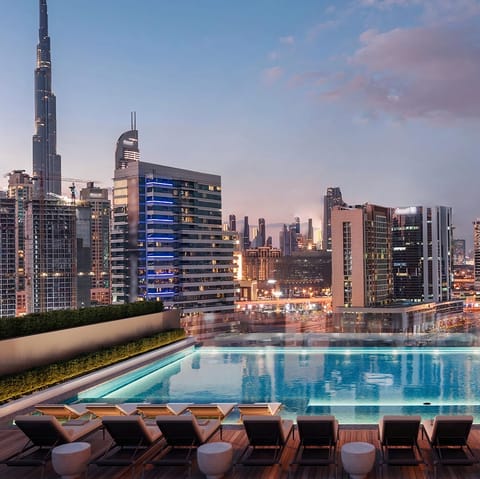 Enjoy sky-grazing views from the building's communal pool