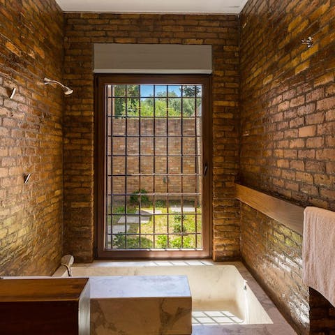 Treat yourself to a long soak in the rustic yet relaxing bathtub