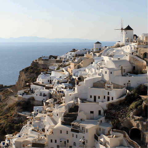 Wind your way through the stunning coastal town of Oia, with breathtaking views across the Aegean Sea