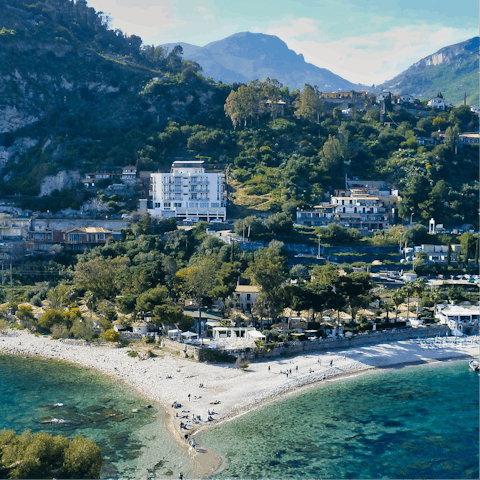 Explore the atmospheric hilltop town of Taormina – a thirty-minute drive away
