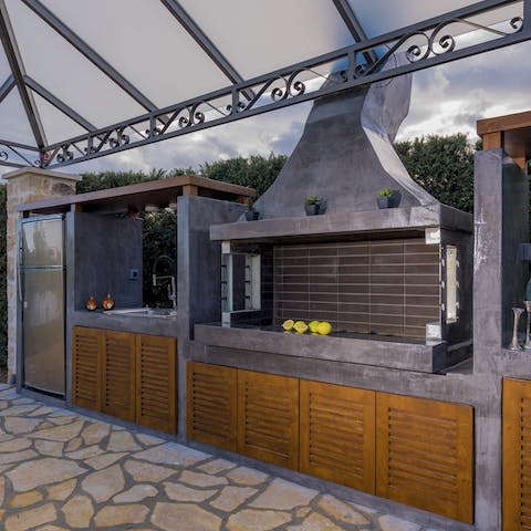 Make use of your well-equipped outdoor kitchen, from keeping beers cold in the fridge to whacking fresh produce on the barbecue
