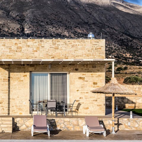Relax on your sun-drenched terrace as the sea stretches out before you