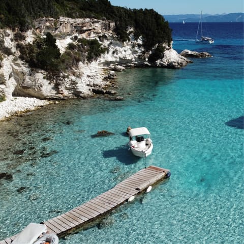 Charter a speedboat from nearby Gaios (a five-minute drive) to explore the island's turquoise bays