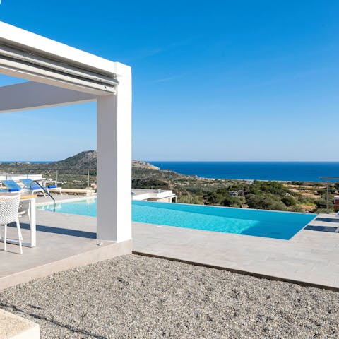 Cool down in the private pool overlooking the Mediterranean Sea beyond