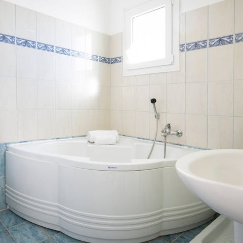 Unwind in the corner bath after a day of exploring Kefalonia