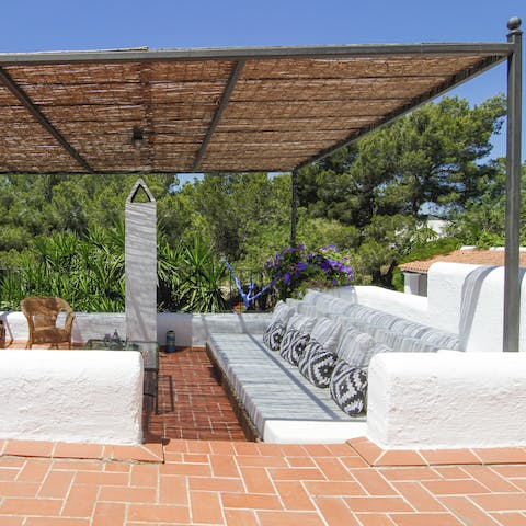 Relax under the pergola with a glass of Spanish wine