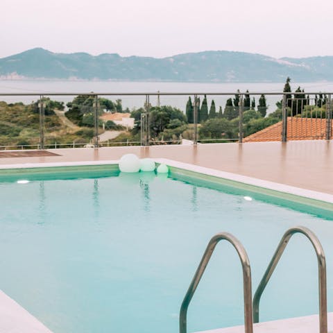 Descend the ladder into your private pool, with postcard views over the Aegean Sea
