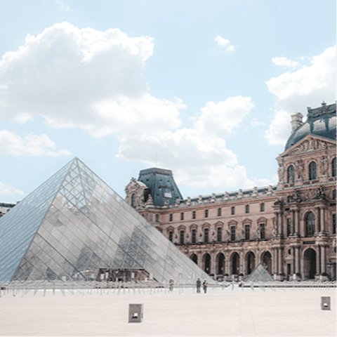 Visit the iconic Louvre Museum, a short walk away