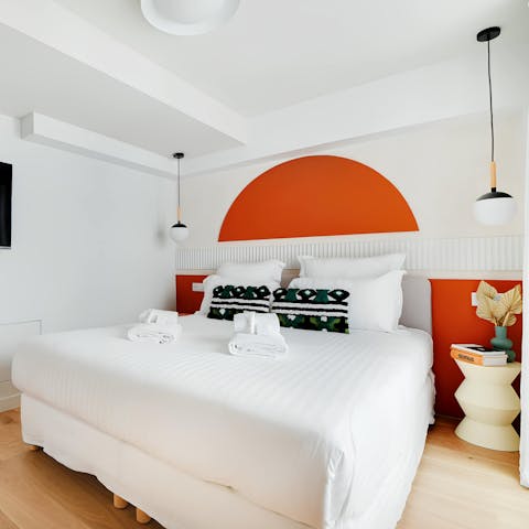 Sink into the sumptuous bed after a day of Paris sightseeing