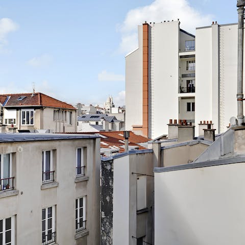 Look out to views of the Sacré-Cœur from the bedroom window