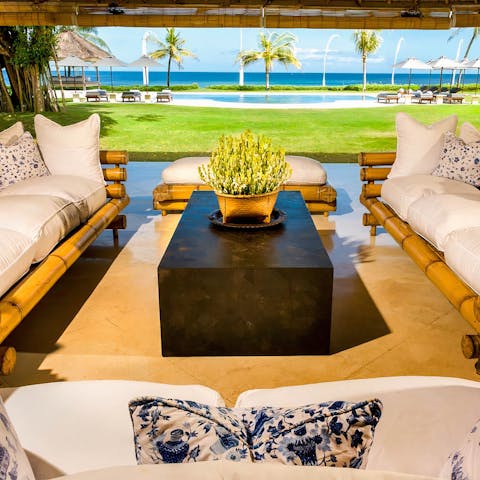 Kick back and unwind in the comfy outdoors lounge area, with those breathtaking sea views before you 