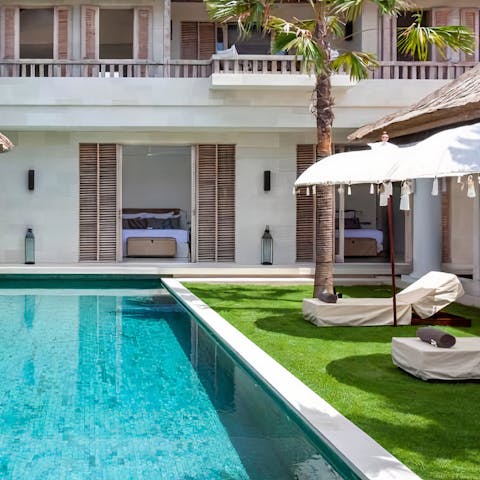 Take the time to relax on the daybeds by the second swimming pool 