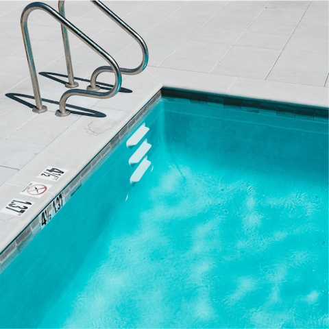 Cool off in the communal pool after visiting the Wings of Mexico Statue