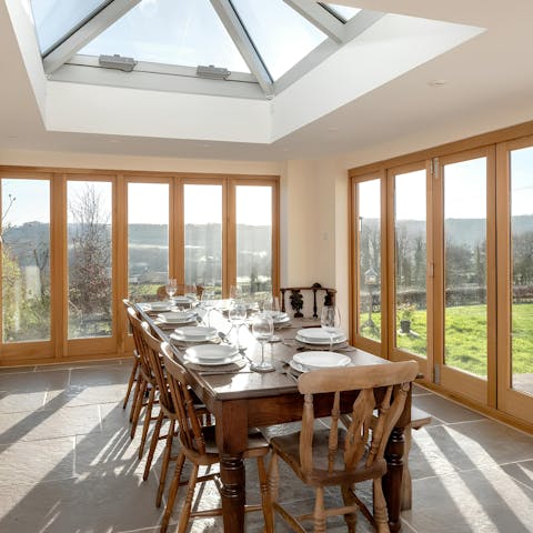 Dine together en famille in the light-filled dining room