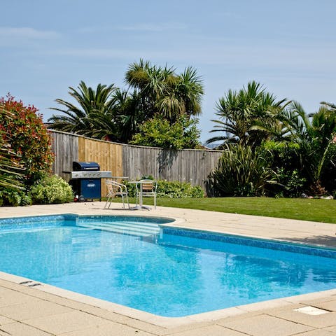 Go for a dip in the pool and soak up the sea breeze at home