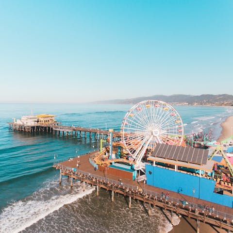 Spend the day strolling along the Santa Monica Pier, about a ten-minute drive away depending on traffic
