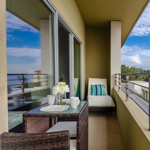 Pad out onto the balcony and enjoy your morning coffee in the rejuvenating ocean breeze