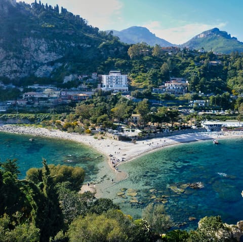 Drive twenty minutes to The Pearl of the Ionian Sea, Isola Bella
