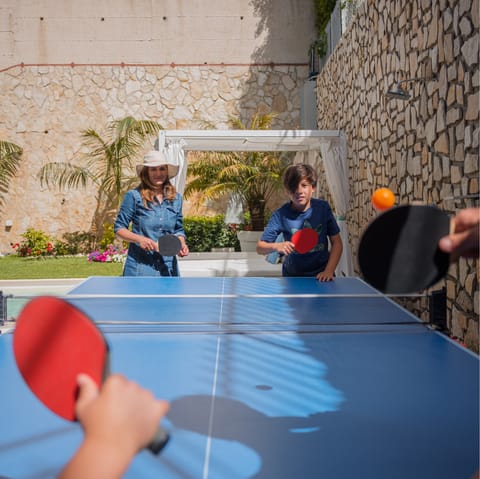 Challenge the family to a table tennis tournament