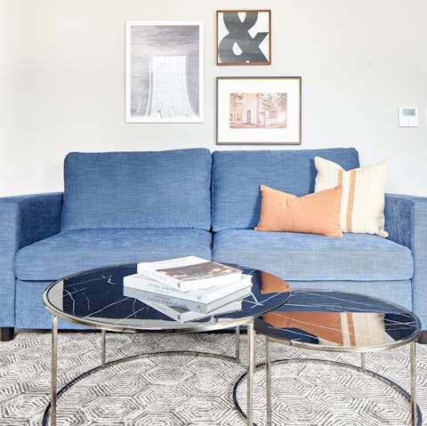 Get comfortable on the squashy blue sofa and flick through the coffee table books