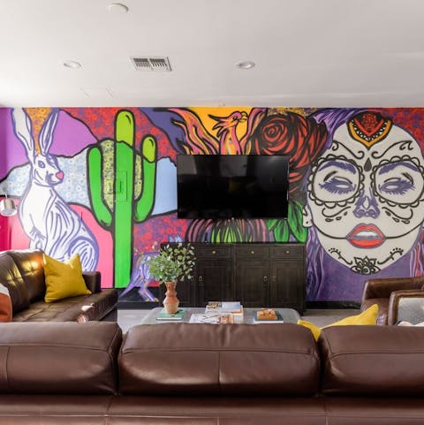 Admire the bright mural in the living room