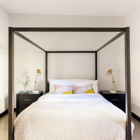 Sleep tight in a modern four poster bed